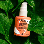 Cultiv Hydra-Boost Serum bottle on a leafy green background