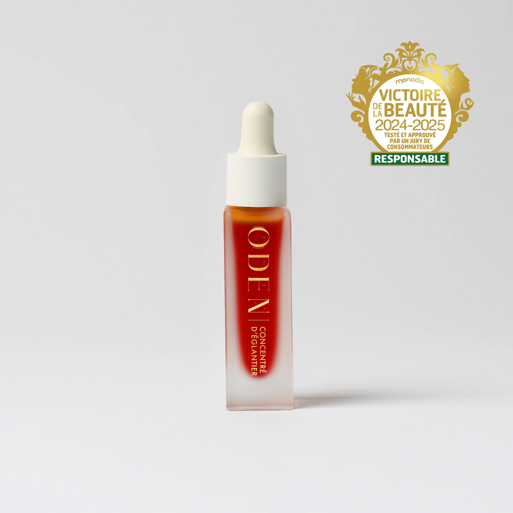 Skincare dropper bottle with 'ODEN' branding on a white background, featuring a gold award logo.